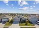 One-story house with gray roof, three-car garage, and solar panels at 12143 Kingsley Trl, Parrish, FL 34219