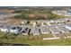 Aerial view of a new community with houses and a lake at 12143 Kingsley Trl, Parrish, FL 34219