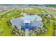 Resort-style pool, clubhouse, playground, and pond in Bella Lago community at 12143 Kingsley Trl, Parrish, FL 34219