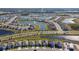 Aerial view of a large community with many houses and lakes at 12143 Kingsley Trl, Parrish, FL 34219
