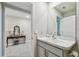 Small bathroom with vanity and a view of the hallway at 12143 Kingsley Trl, Parrish, FL 34219