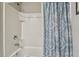 Clean bathroom with tub/shower combo and patterned shower curtain at 12143 Kingsley Trl, Parrish, FL 34219