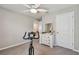 Bright bedroom with a ceiling fan, dresser, and exercise bike at 12143 Kingsley Trl, Parrish, FL 34219