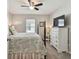 Bedroom with a TV, dresser, and a coastal theme at 12143 Kingsley Trl, Parrish, FL 34219