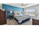 Spacious bedroom with a comfy bed and blue accent wall at 12143 Kingsley Trl, Parrish, FL 34219