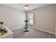 Bright bedroom with a stationary bike and ceiling fan at 12143 Kingsley Trl, Parrish, FL 34219