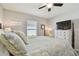 Bedroom with coastal decor and ceiling fan at 12143 Kingsley Trl, Parrish, FL 34219