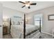 Bedroom with coastal bedding and ceiling fan at 12143 Kingsley Trl, Parrish, FL 34219