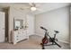 Bedroom with a stationary bike and a dresser at 12143 Kingsley Trl, Parrish, FL 34219