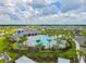 Community pool with a cabana and surrounding landscaping at 12143 Kingsley Trl, Parrish, FL 34219