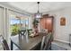 Dining room with view to backyard and sliding glass doors, adjacent to kitchen at 12143 Kingsley Trl, Parrish, FL 34219
