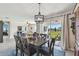 Bright dining room with view to backyard and sliding glass doors at 12143 Kingsley Trl, Parrish, FL 34219
