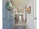 Bright and spacious entry hall with tile flooring and a view to the living area at 12143 Kingsley Trl, Parrish, FL 34219
