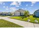 Two-story house with a two-car garage and a neatly landscaped lawn at 12143 Kingsley Trl, Parrish, FL 34219