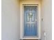 Gray front door accented with a wreath at 12143 Kingsley Trl, Parrish, FL 34219