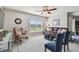 Gathering room with leather sofa and view to the backyard at 12143 Kingsley Trl, Parrish, FL 34219