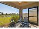 Relaxing screened porch overlooking a pond and landscape at 12143 Kingsley Trl, Parrish, FL 34219