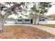 Ranch style home with a large yard and mature trees at 1220 10Th Sw St, Largo, FL 33770