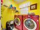 Laundry room with washer, dryer, and shelving at 1334 Windsor Way, Lutz, FL 33559