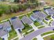 Aerial view of neighborhood homes and street at 16732 Mooner Plank Cir, Wimauma, FL 33598