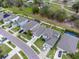 Aerial view of neighborhood with houses and street at 16732 Mooner Plank Cir, Wimauma, FL 33598