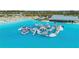 Aerial view of resort-style pool with inflatable playground at 16732 Mooner Plank Cir, Wimauma, FL 33598