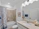 Guest bathroom with tub shower combo and updated vanity at 16732 Mooner Plank Cir, Wimauma, FL 33598