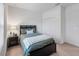 Bedroom with full bed, nightstand, and double door closet at 16732 Mooner Plank Cir, Wimauma, FL 33598
