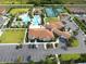 Aerial view of community pool, tennis courts, and clubhouse at 16732 Mooner Plank Cir, Wimauma, FL 33598