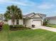 Well-maintained one-story house with a lush green lawn at 16732 Mooner Plank Cir, Wimauma, FL 33598