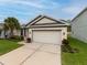 Charming single-story home with a spacious driveway at 16732 Mooner Plank Cir, Wimauma, FL 33598