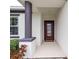 Inviting entryway with a red door and decorative glass at 16732 Mooner Plank Cir, Wimauma, FL 33598