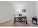 Functional home office with a large desk and ample space at 16732 Mooner Plank Cir, Wimauma, FL 33598