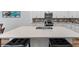 Spacious kitchen island with a large quartz countertop and double sink at 16732 Mooner Plank Cir, Wimauma, FL 33598