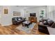Comfortable living room with leather sofas and a fireplace at 16732 Mooner Plank Cir, Wimauma, FL 33598