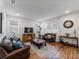 Spacious living room featuring hardwood floors and ample natural light at 16732 Mooner Plank Cir, Wimauma, FL 33598