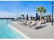 Relaxing resort-style pool with lounge chairs and umbrellas at 16732 Mooner Plank Cir, Wimauma, FL 33598