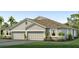 Two-story house with gray siding, two-car garage, and landscaping at 18134 Cropside Trl, Lakewood Ranch, FL 34211