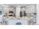Modern kitchen with gray cabinets, granite counters, and an island at 18134 Cropside Trl, Lakewood Ranch, FL 34211