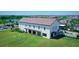 Large community center with expansive lawn and outdoor games at 18137 Cropside Trl, Lakewood Ranch, FL 34211