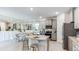 Modern kitchen with island and granite countertops at 18137 Cropside Trl, Lakewood Ranch, FL 34211