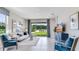 Comfortable living room with sliding glass doors at 18137 Cropside Trl, Lakewood Ranch, FL 34211