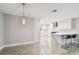 Modern dining room features tile floor and open concept to kitchen at 1927 Montana Ne Ave, St Petersburg, FL 33703