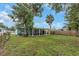 Backyard view showcasing patio and grassy area at 206 N Himes Ave, Tampa, FL 33609