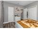 Bedroom with double bed, closet, and dresser at 206 N Himes Ave, Tampa, FL 33609