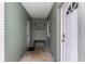 Home's entryway with modern wall art and a bench at 206 N Himes Ave, Tampa, FL 33609