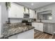 Modern kitchen with granite countertops and stainless steel appliances at 206 N Himes Ave, Tampa, FL 33609