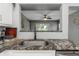 Kitchen sink and granite countertop detail at 206 N Himes Ave, Tampa, FL 33609