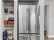 Stainless steel refrigerator and pantry with shelves at 206 N Himes Ave, Tampa, FL 33609