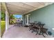 Covered patio with table and chairs at 206 N Himes Ave, Tampa, FL 33609